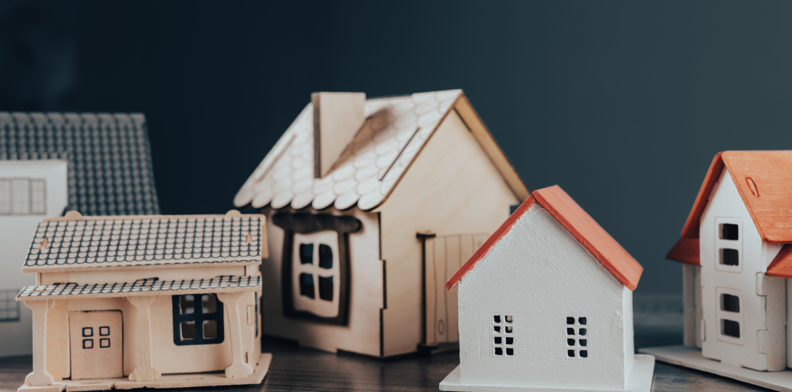 Multiple toy houses on a table