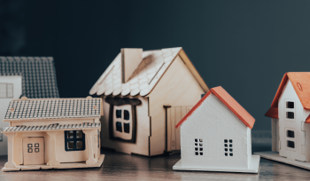 Multiple toy houses on a table